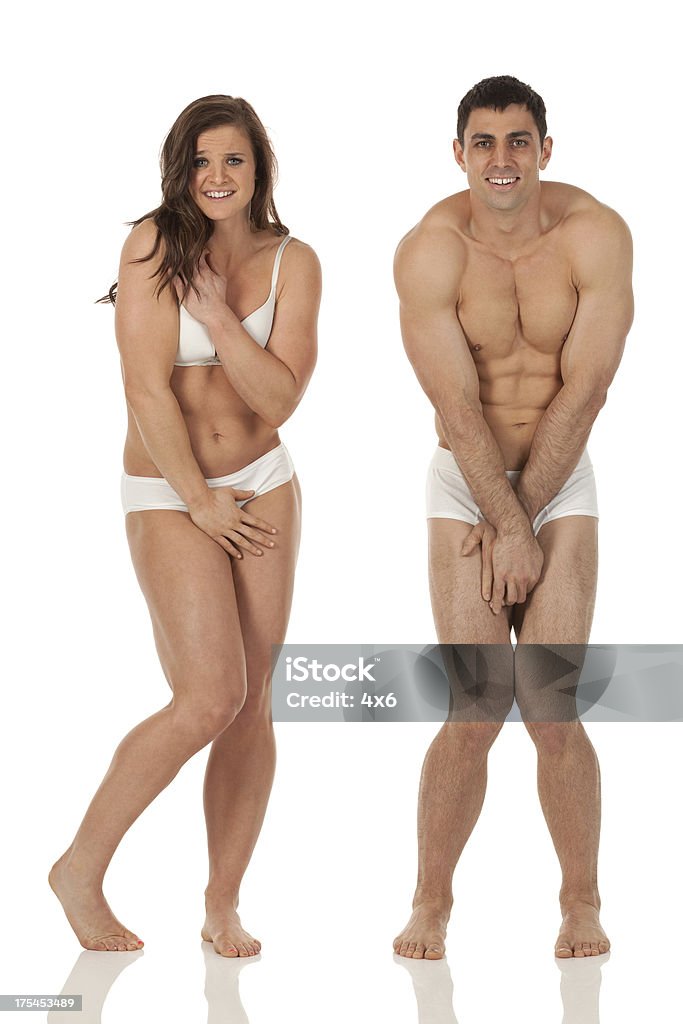 Embarrassed Couple In Undergarments Stock Photo - Download Image Now -  Shirtless, Bra, Hiding - iStock