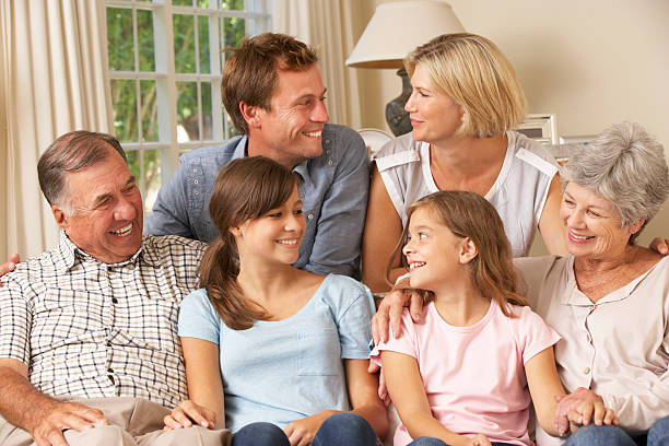 istock Multi Generation Family Group Sitting On Sofa Indoors 175453537