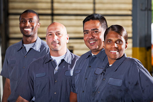 istock Team of mechanics in dark gray uniforms 175453928