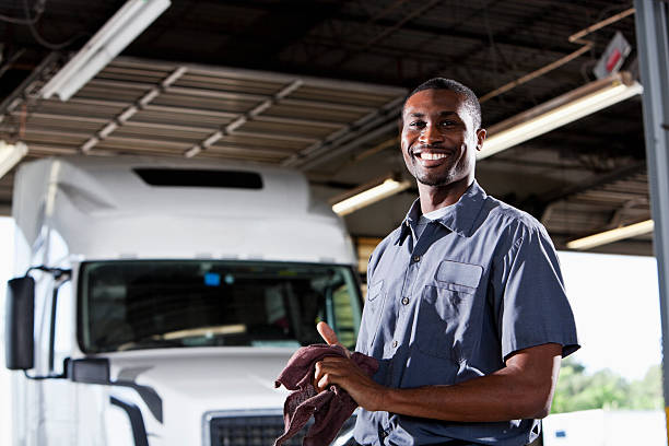 istock Mechanic in garage with semi-truck 175453937