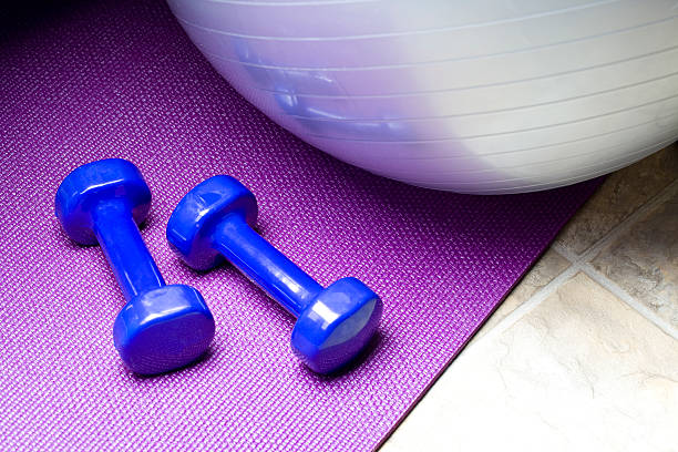 Fitness Equipment Weights, matt, towel and exercise ball. fitness ball photos stock pictures, royalty-free photos & images