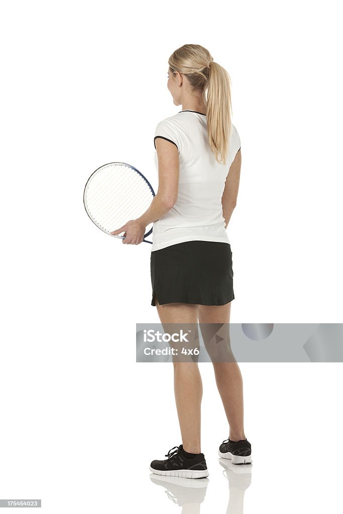 Vista posterior de una mujer jugador de tenis - Foto de stock de Tenis libre de derechos