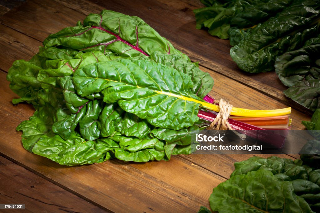 Rainbow Swiss Chard Organic Rainbow Swiss Chard Bunch on Wood Table Chard Stock Photo