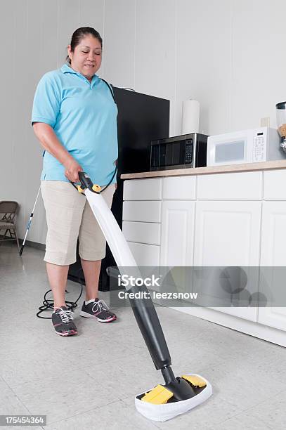 Woman Cleaning A Corporate Break Room Stock Photo - Download Image Now - Adult, Adults Only, Business