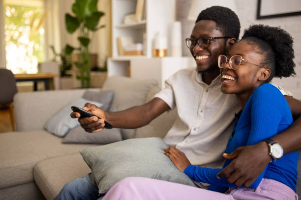istock Couple watching tv at home 1754546772