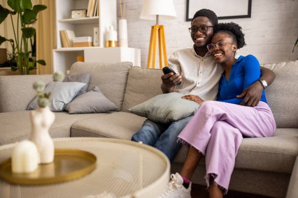 istock Couple watching tv at home 1754547382
