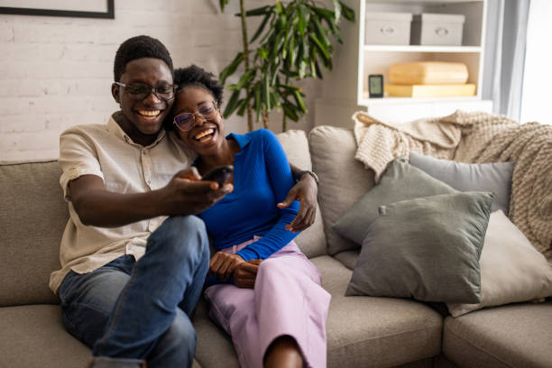 istock Couple watching tv at home 1754547925
