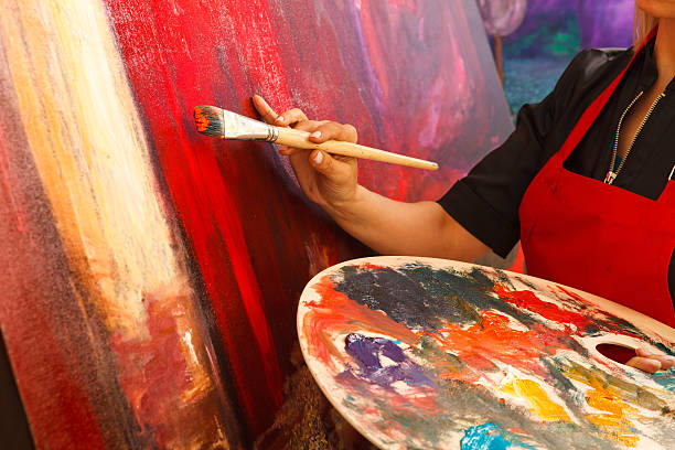 istock Artist putting the final magic touch on painting 175455126
