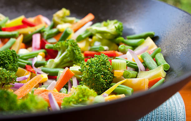 Vegetable Stir Fry stir-fry cooking in a wok stir fried stock pictures, royalty-free photos & images