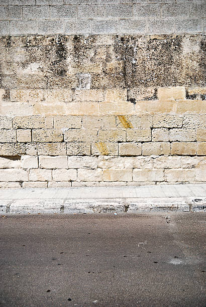 istock Old concrete grunge wall with sidewalk 175455222