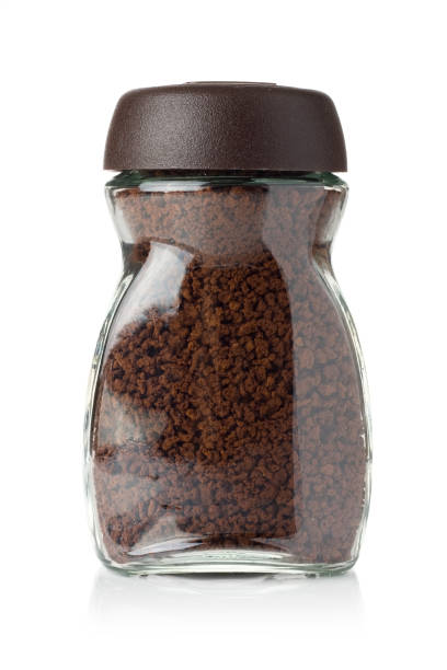 Instant coffee A jar of instant coffee isolated on white background. instant coffee stock pictures, royalty-free photos & images