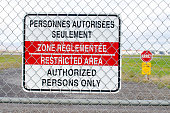 Warning sign of the airport fence