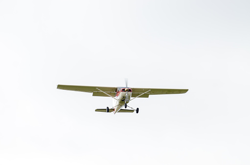 Small propeller airplane approaching the Quebec city airport during autumn day.