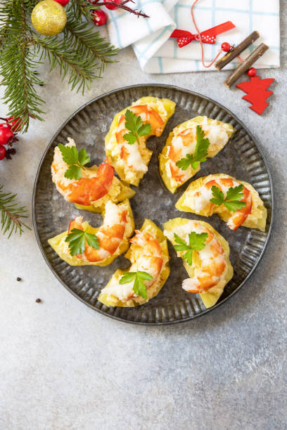istock Christmas appetizers. Shrimp on pineapple with cheese filling on the festive table. View from above. Copy space. 1754576621