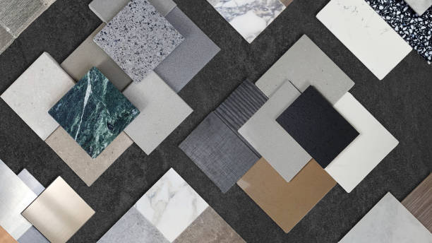istock samples of interior material contains ceramic tiles, artificial stones, marbles, stainless, quartz, terrazzo placed on black stone marble table. interior design selected material for idea. 1754579930