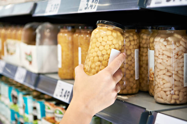 Chickpea can in hand in shop