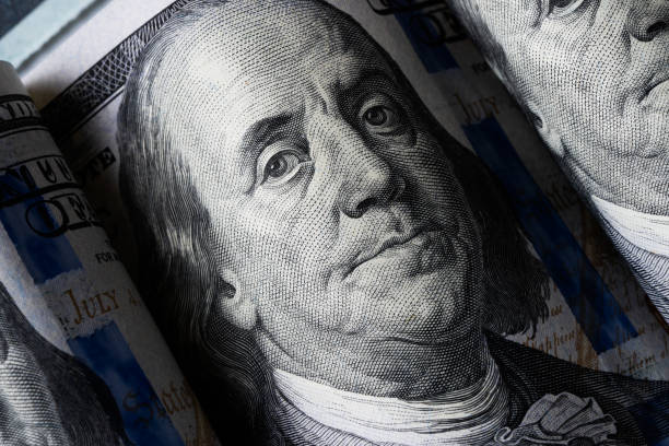 istock Closeup portrait Benjamin Franklin on 100 us dollar bill. 1754612791