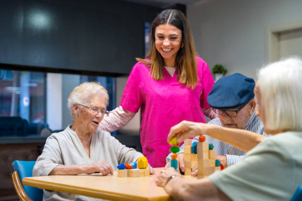 istock Nurse and elder people playing skill games 1754620198