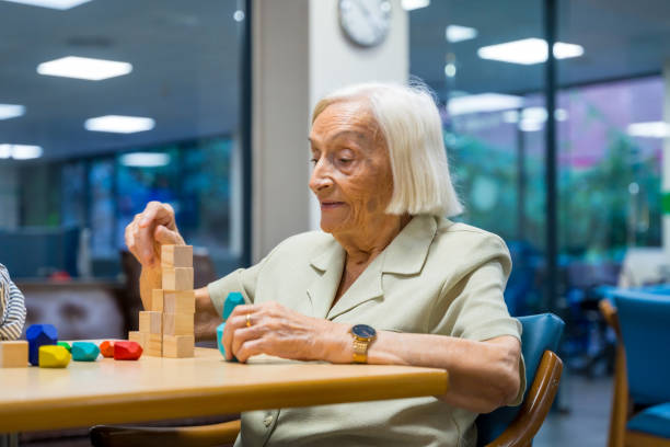 istock Woman in a nursing home playing skill games 1754621842