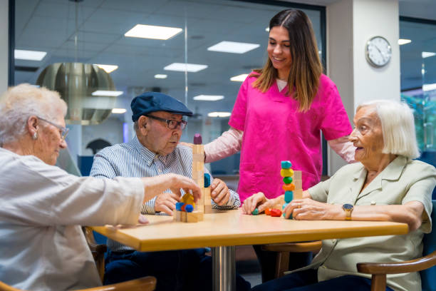 istock People playing skill games with nurse in a nursing home 1754621844