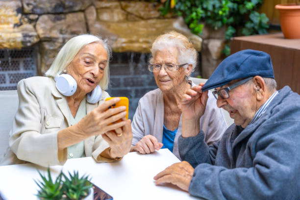 istock Seniors using phone and listening to music in a geriatric 1754623455