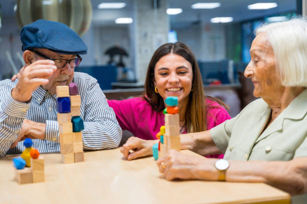 istock Nurse supervising seniors playing skill games in a nursing home 1754626832