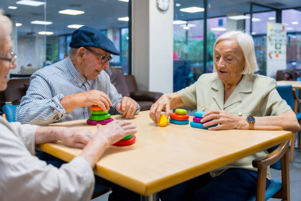 istock Aged people in a nursing home sharing skills games 1754627717