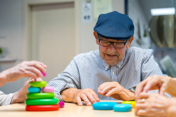 istock Elder man playing skill games in a nursing home 1754627729