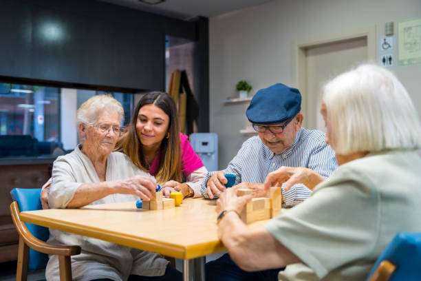 istock Elderly people in a nursing home sharing skills games 1754627731