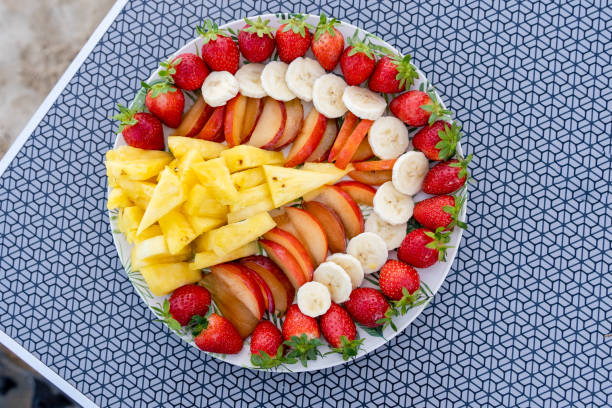 istock Dish of healthy fresh fruit salad on table background. Top view 1754627812