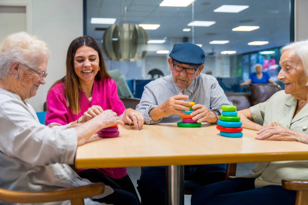 istock Nurse helping a elder woman playing skill games 1754628273