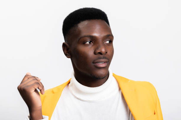 istock Thoughtful emotional African man posing over white background in studio isolated while shooting process 1754628569