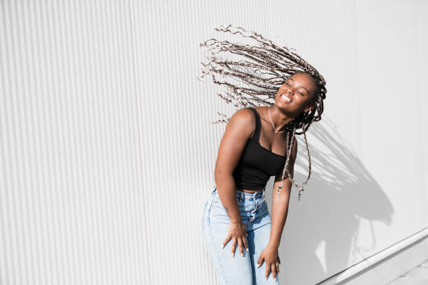 istock Stylish woman with a braids on white background 1754629499