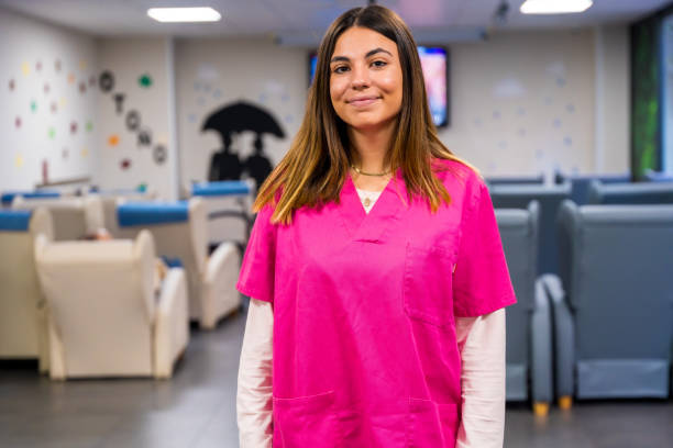 istock Friendly nurse of a nursing home standing indoors 1754643466