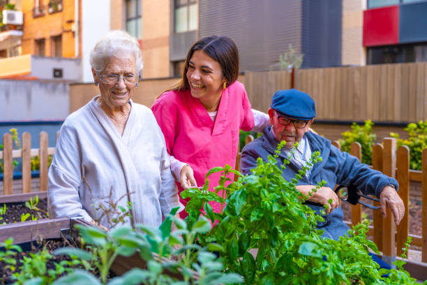 istock Nurse and elder people in a garden in a geriatric 1754646704