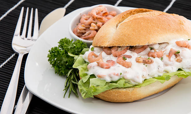 istock Roll with Shrimp-Salad on a cutting board 175464918