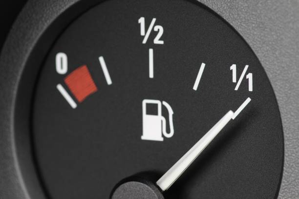 istock fuel gauge in car dashboard - full 1754650018