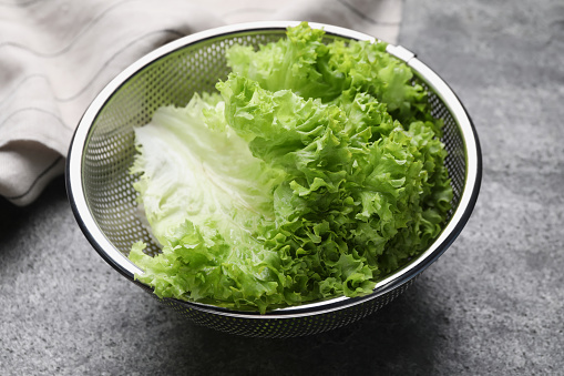 Fresh lettuce on stone table. Salad greens