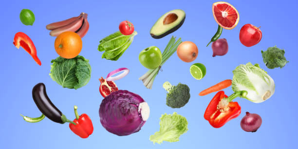 istock Many fresh vegetables and fruits falling on pastel blue background 1754650816