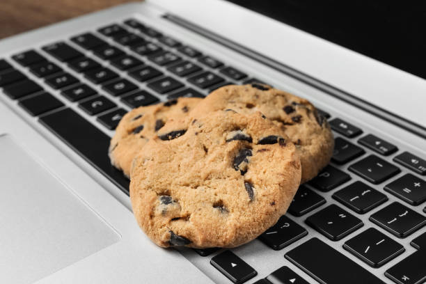 istock Chocolate chip cookies on laptop, closeup view 1754650915