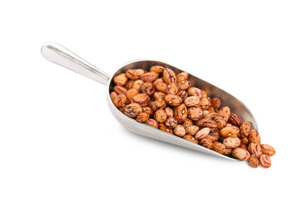 istock Metal scoop with dry kidney beans isolated on white 1754651373
