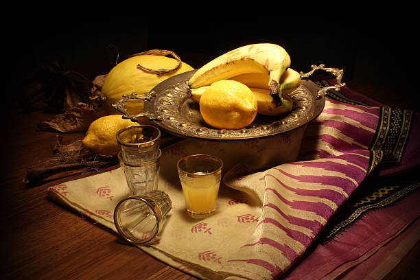 Classical still life with yellow fruit Classical, low-key still life with yellow fruit, like lemons and bananas antique fruit bowl stock pictures, royalty-free photos & images