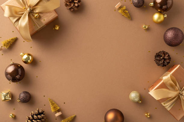 istock Sophisticated composition for holiday season, featuring lavish presents with bows, extravagant brown, gold balls, petite fir embellishments on rich brown surface, providing ideal frame for greetings 1754682346