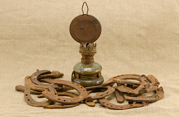 istock retro kerosene lamp rusty horse shoes linen 175468651