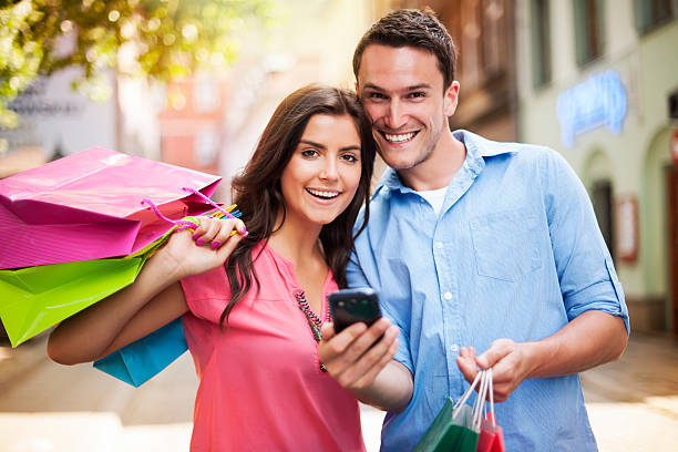 istock Happy couple using smart phone during the shopping 175469138