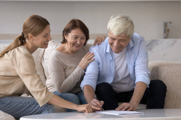 istock Happy senior customer signing retirement insurance agreement 1754693530
