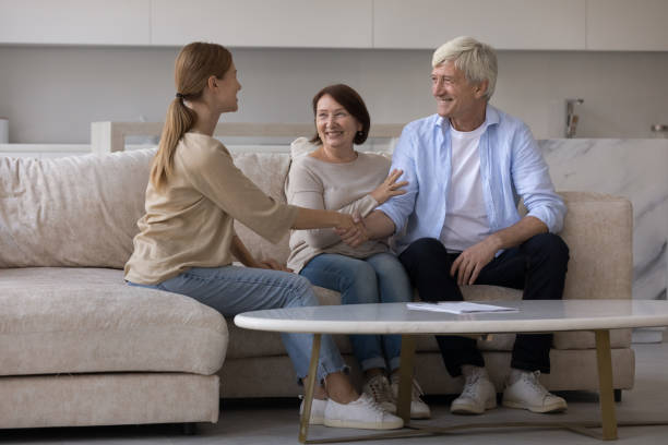 istock Happy satisfied elderly couple and agent shaking hands 1754694008