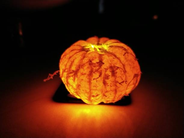 istock luminous tangerine on a dark background 1754701743