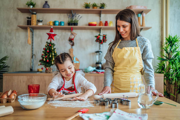 the beginning of some yummy christmas cookies - pastry cutter family holiday child imagens e fotografias de stock