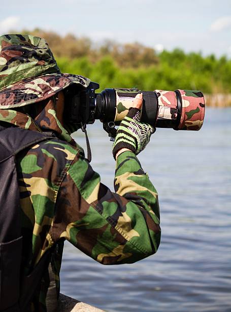 istock photographer taking photo in wild 175471271
